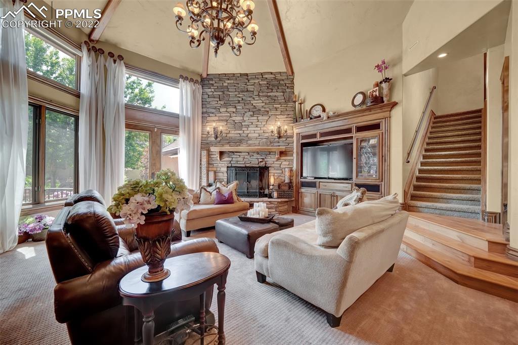 4 3rd Street Colorado Springs, CO 80906 - Photo 43 of 50 a living room with furniture a chandelier and a fireplace