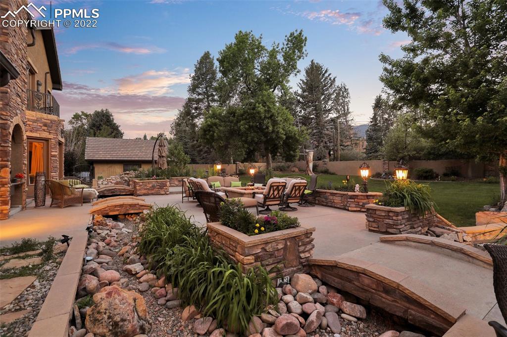 4 3rd Street Colorado Springs, CO 80906 - Photo 44 of 50 a view of a patio with table and chairs and a fire pit