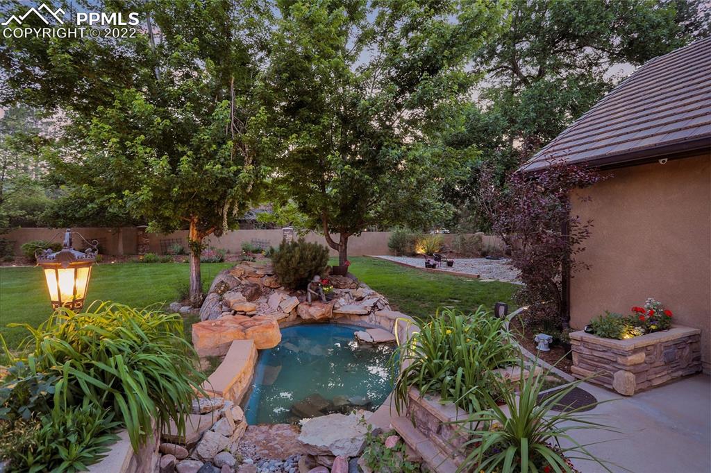 4 3rd Street Colorado Springs, CO 80906 - Photo 45 of 50 a backyard of a house with lots of green space