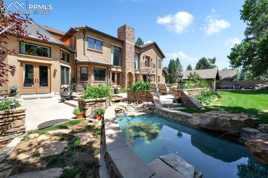 4 3rd Street Colorado Springs, CO 80906 - Photo 46 of 50 a view of a house with backyard and sitting area