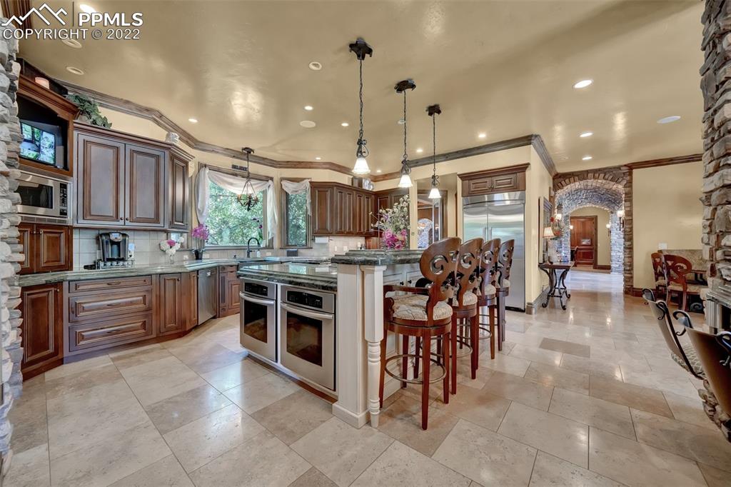 4 3rd Street Colorado Springs, CO 80906 - Photo 9 of 50 a kitchen with lots of counter top space and appliances