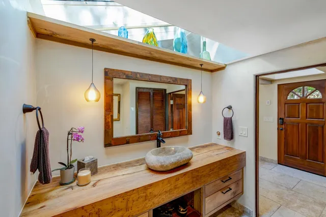 a bathroom with a sink and a mirror