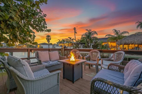a balcony view with two chairs and a table