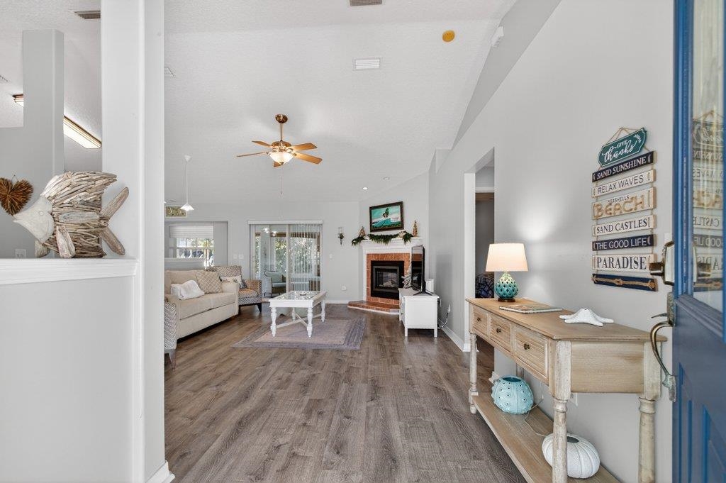 254 Basque Road St. Augustine, FL 32080 - Photo 16 of 67 a living room with furniture and wooden floor