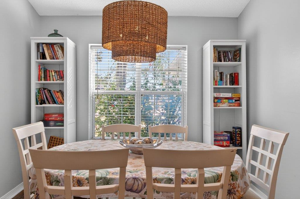 254 Basque Road St. Augustine, FL 32080 - Photo 19 of 67 a dining room with furniture and a window