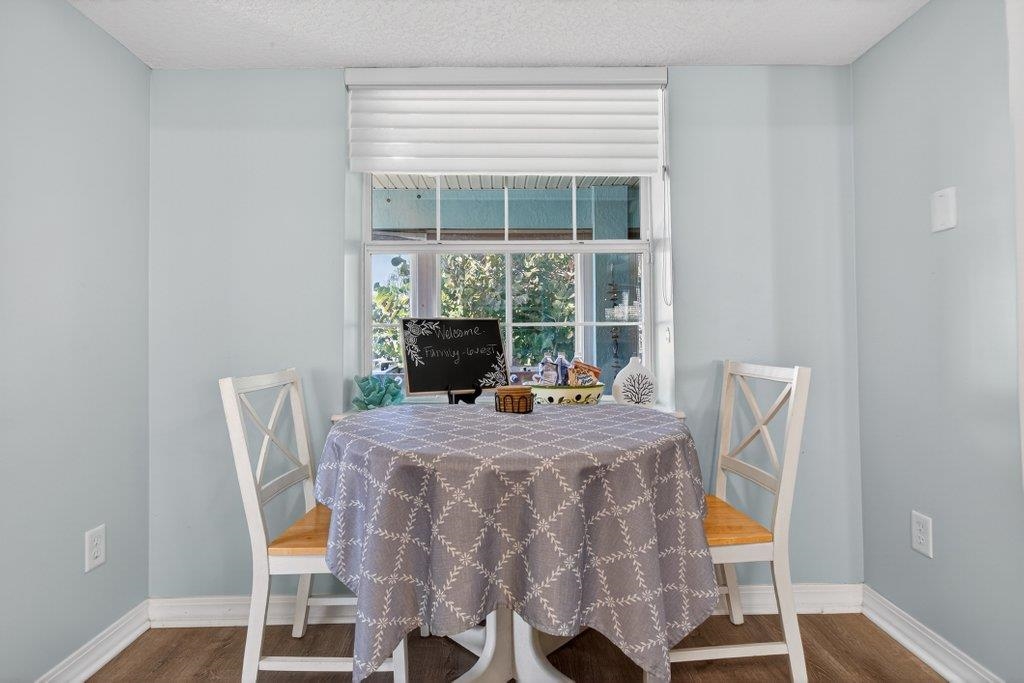 254 Basque Road St. Augustine, FL 32080 - Photo 28 of 67 a view of a dining room with furniture and wooden floor