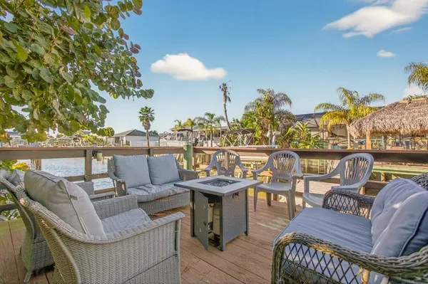 a view of a terrace with furniture and a table
