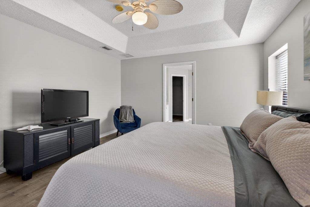 254 Basque Road St. Augustine, FL 32080 - Photo 32 of 67 a bedroom with a bed and a flat screen tv