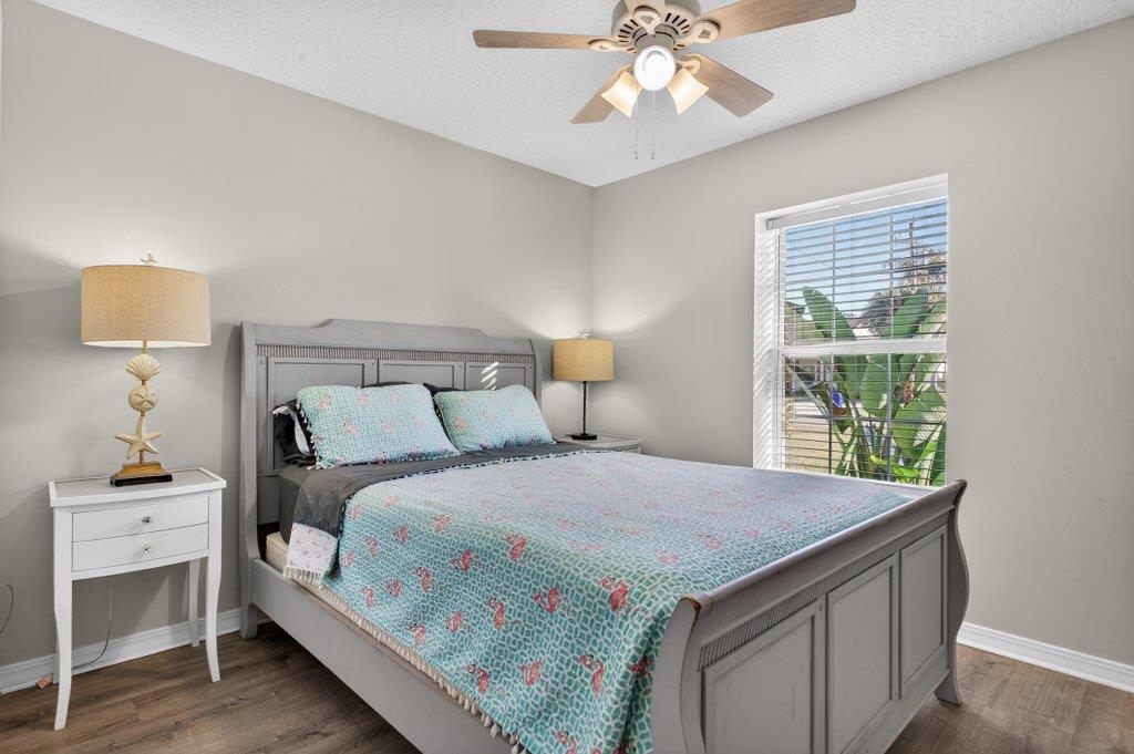 254 Basque Road St. Augustine, FL 32080 - Photo 44 of 67 a bedroom with a bed and a lamp