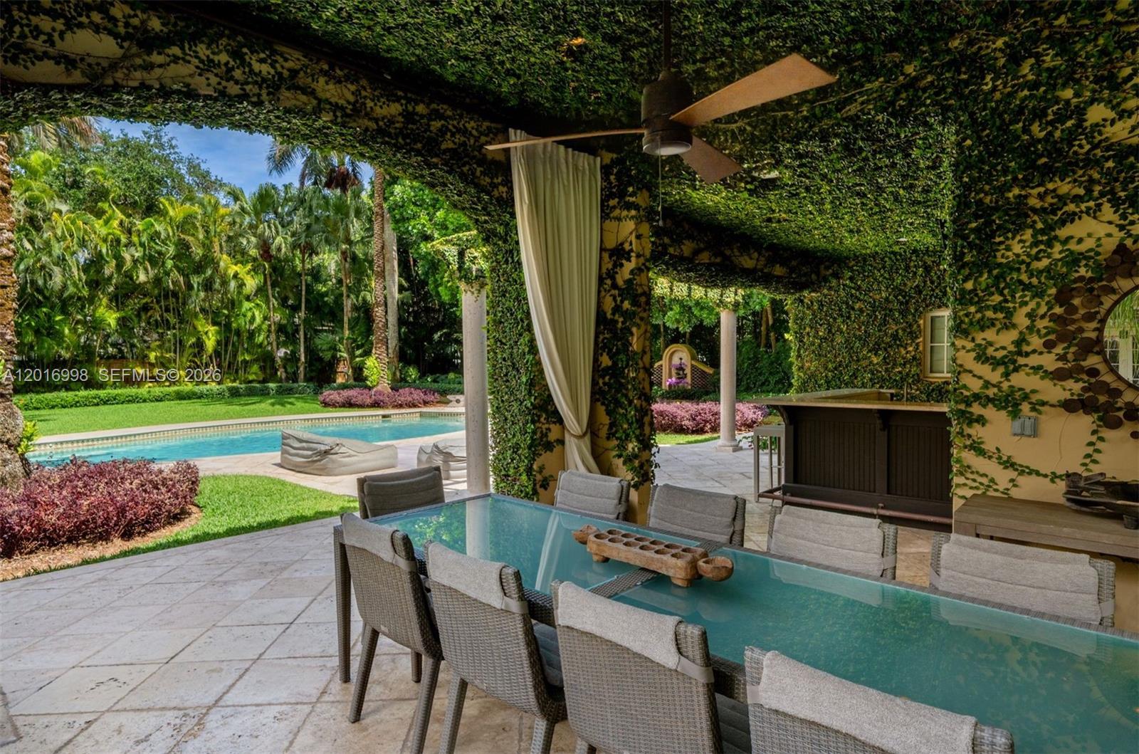 4790 Southwest 78th Street Miami, FL 33143 - Photo 26 of 33 a view of backyard with swimming pool and outdoor seating