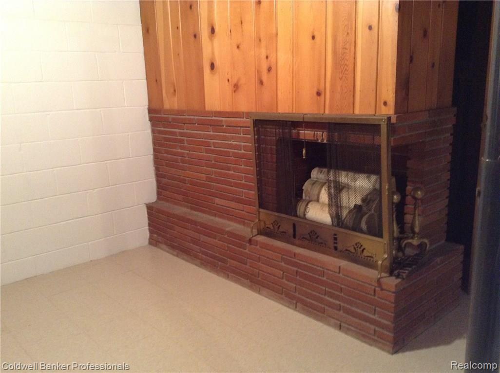 1047 Turrill Road Lapeer, MI 48446 - Photo 36 of 58 Different view of fireplace in basement.