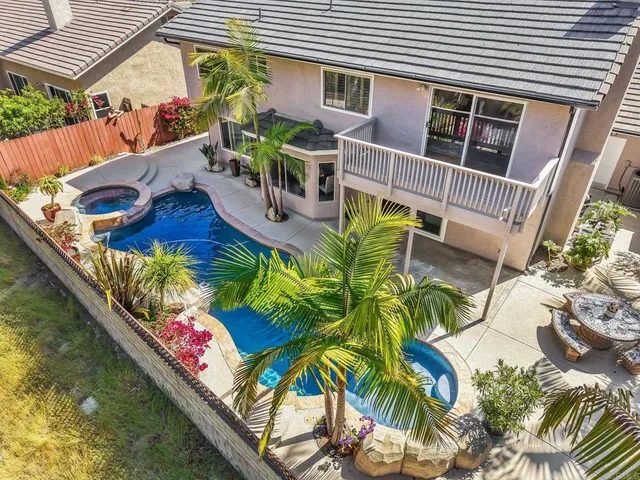 a view of swimming pool with outdoor seating