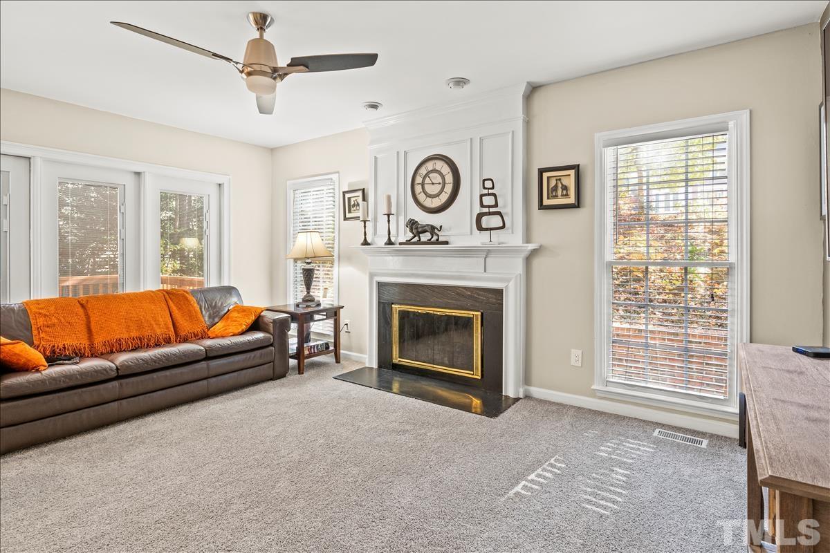 4737 Sinclair Drive Raleigh, NC 27616 - Photo 14 of 29 a living room with furniture and a fireplace