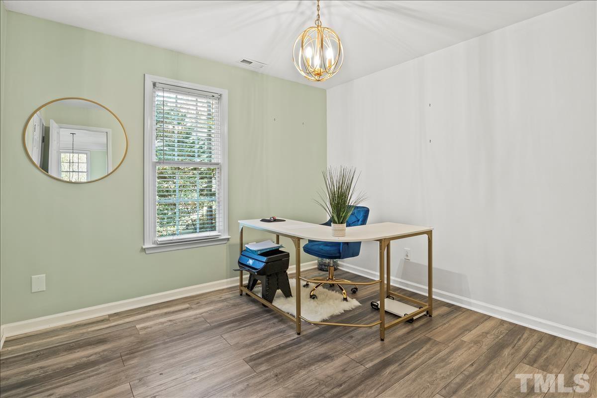 4737 Sinclair Drive Raleigh, NC 27616 - Photo 21 of 29 a view of a room with a table and chairs