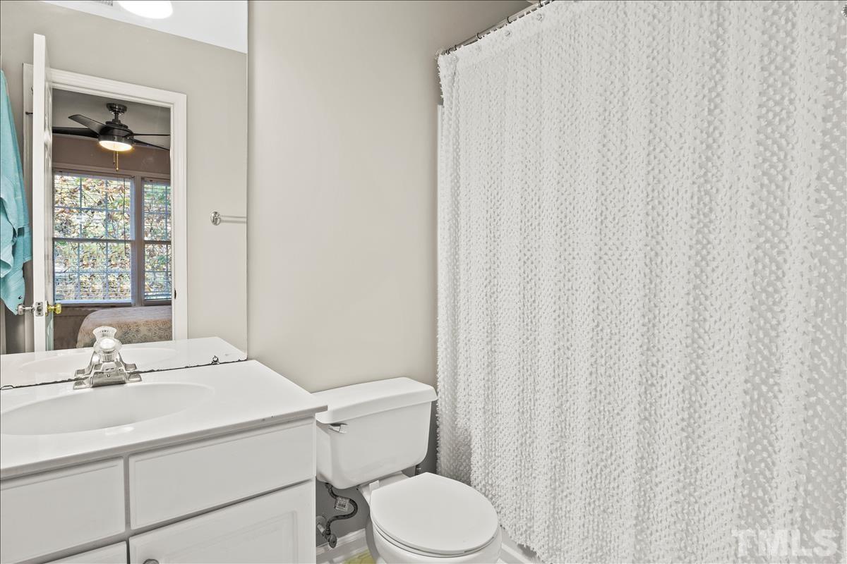 4737 Sinclair Drive Raleigh, NC 27616 - Photo 23 of 29 a bathroom with a sink toilet and window