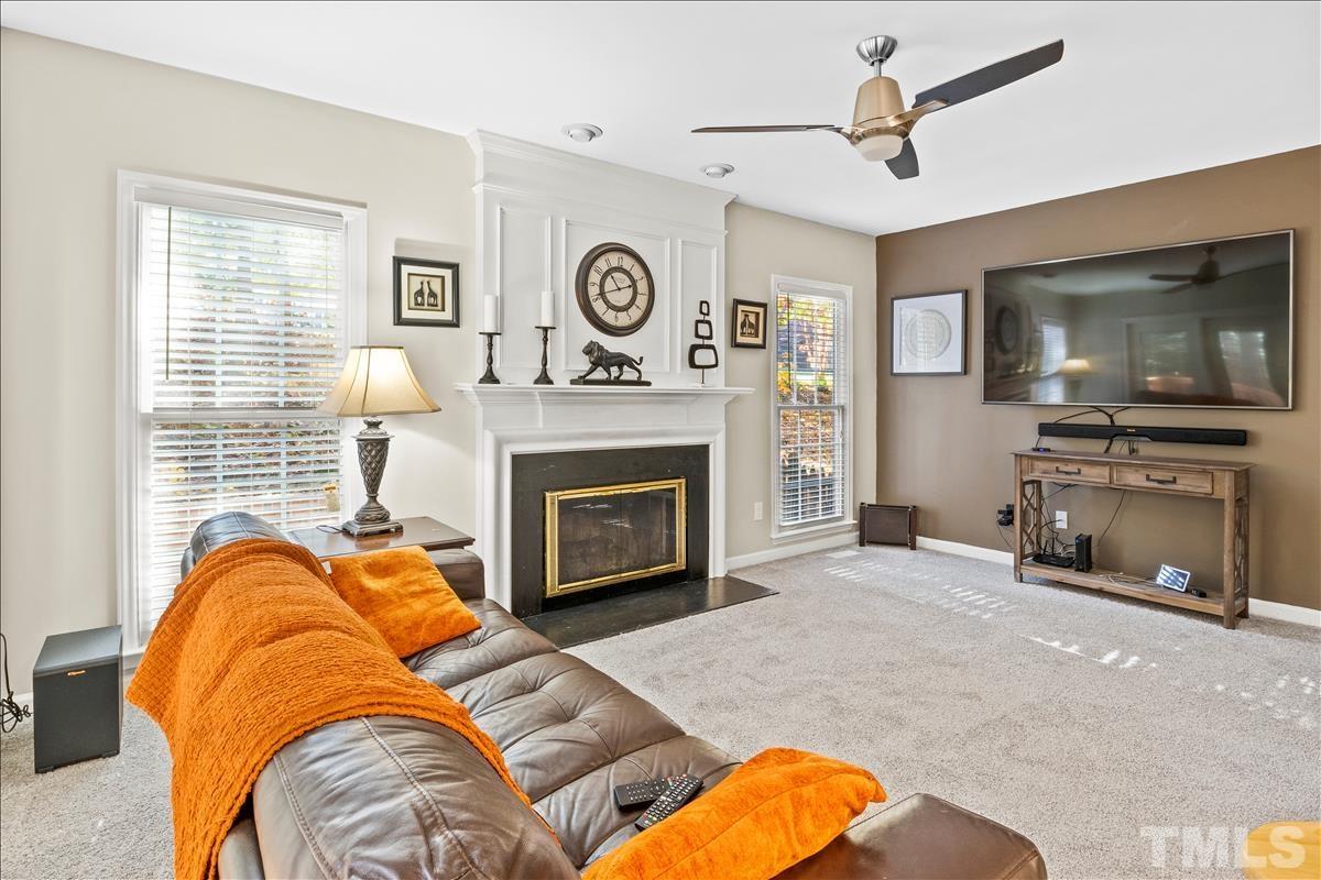 4737 Sinclair Drive Raleigh, NC 27616 - Photo 29 of 29 a living room with furniture and a fireplace