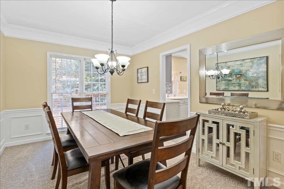 4737 Sinclair Drive Raleigh, NC 27616 - Photo 8 of 29 a view of a dining room with furniture window and wooden floor