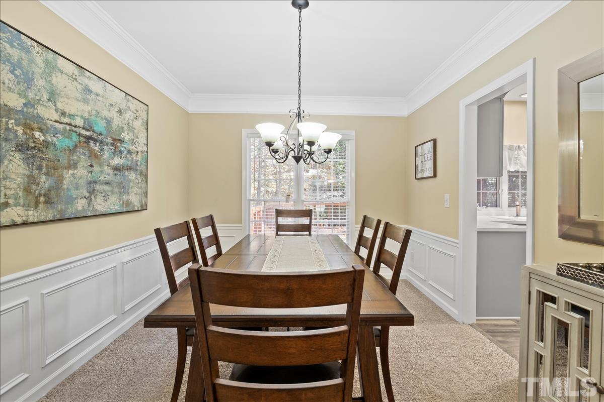 4737 Sinclair Drive Raleigh, NC 27616 - Photo 9 of 29 a view of a dining room with furniture window and wooden floor