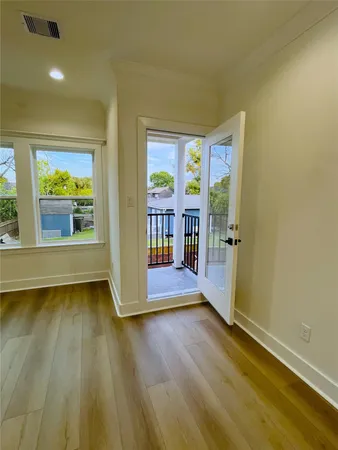a bedroom with a bed and cabinets