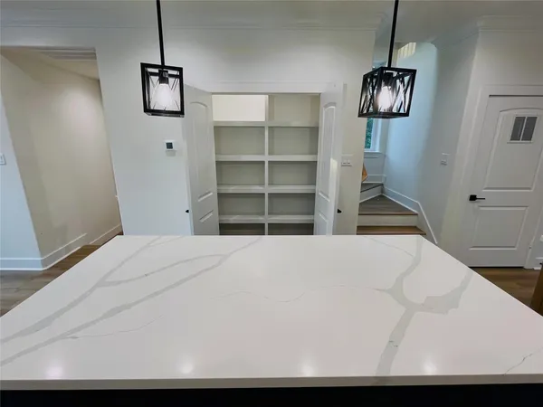 a living room with kitchen island furniture and a kitchen view