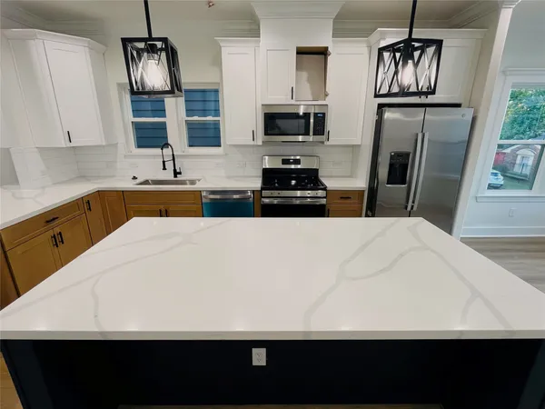 a bathroom with a sink toilet and mirror