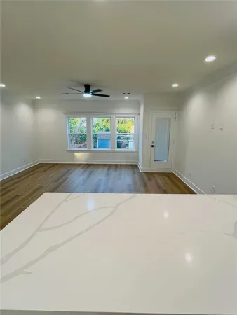 a view of room with wooden floor and window