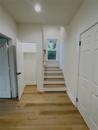 a view of backyard with hardwood area