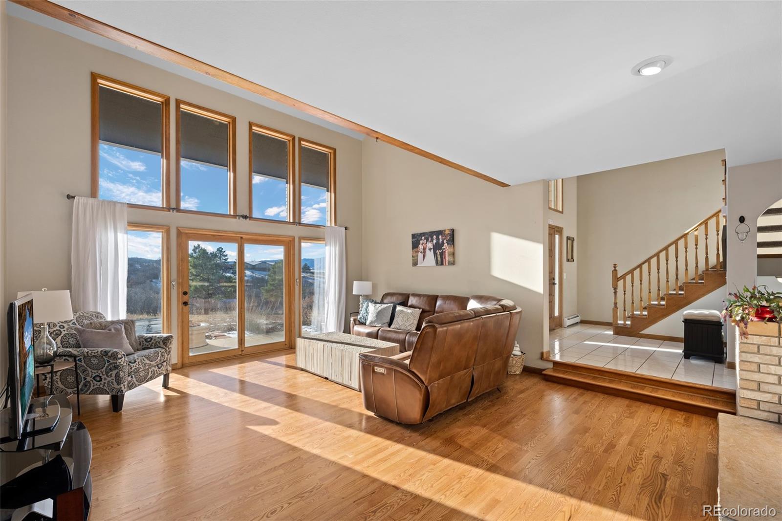 4205 West Parkridge Road Sedalia, CO 80135 - Photo 19 of 50 a living room with furniture and a large window