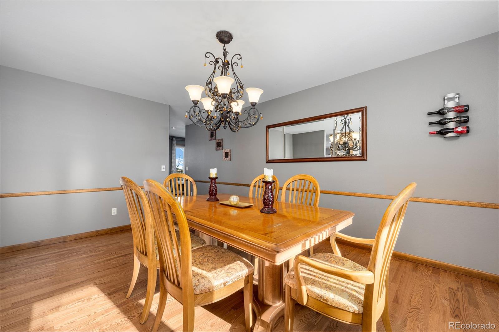 4205 West Parkridge Road Sedalia, CO 80135 - Photo 31 of 50 a dining room with furniture and chandelier