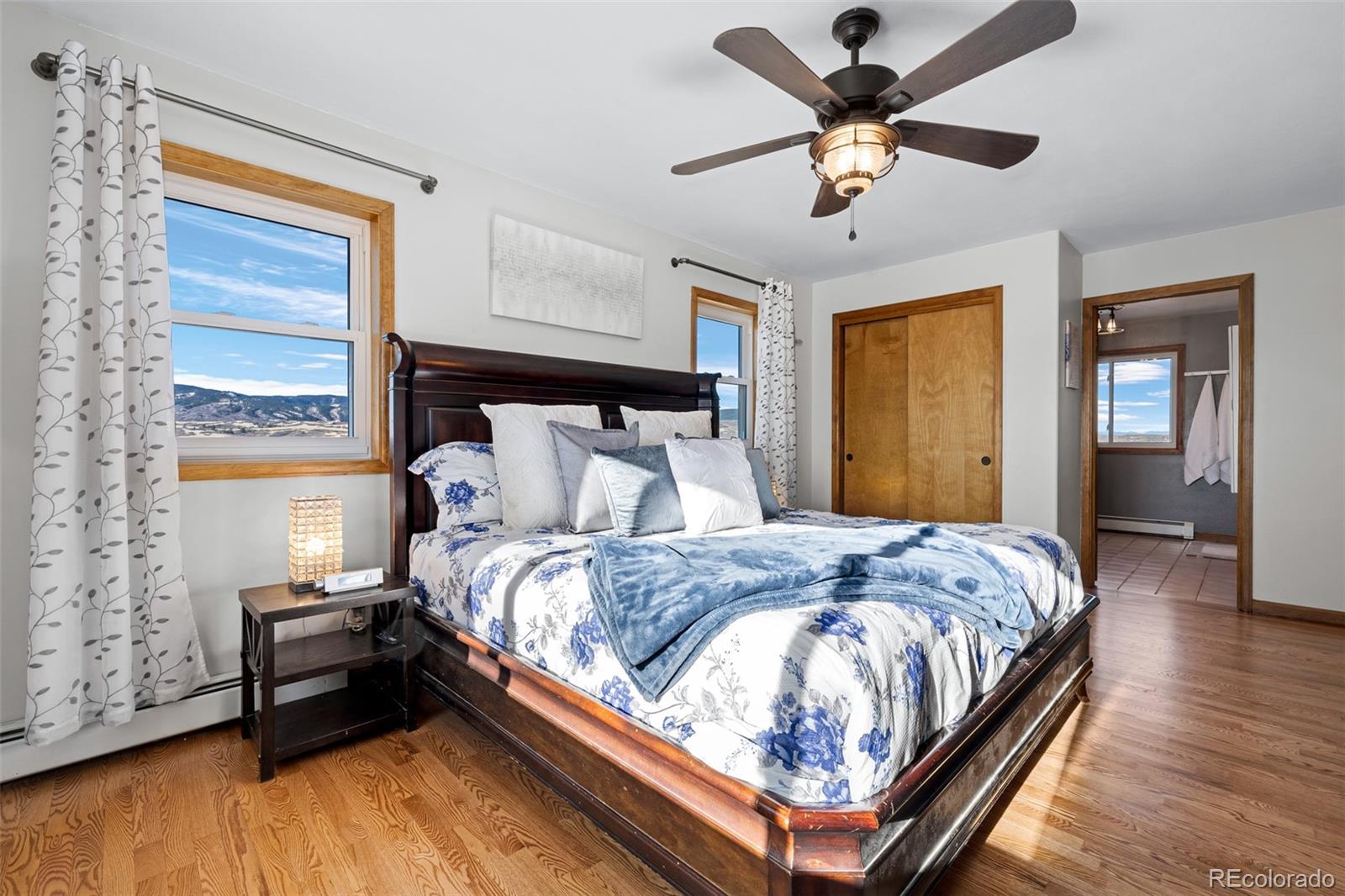 4205 West Parkridge Road Sedalia, CO 80135 - Photo 33 of 50 a bedroom with a bed and window