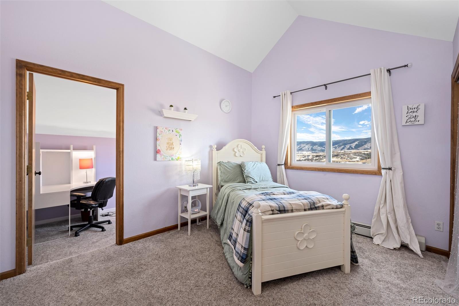 4205 West Parkridge Road Sedalia, CO 80135 - Photo 39 of 50 a bed room with a bed and a window