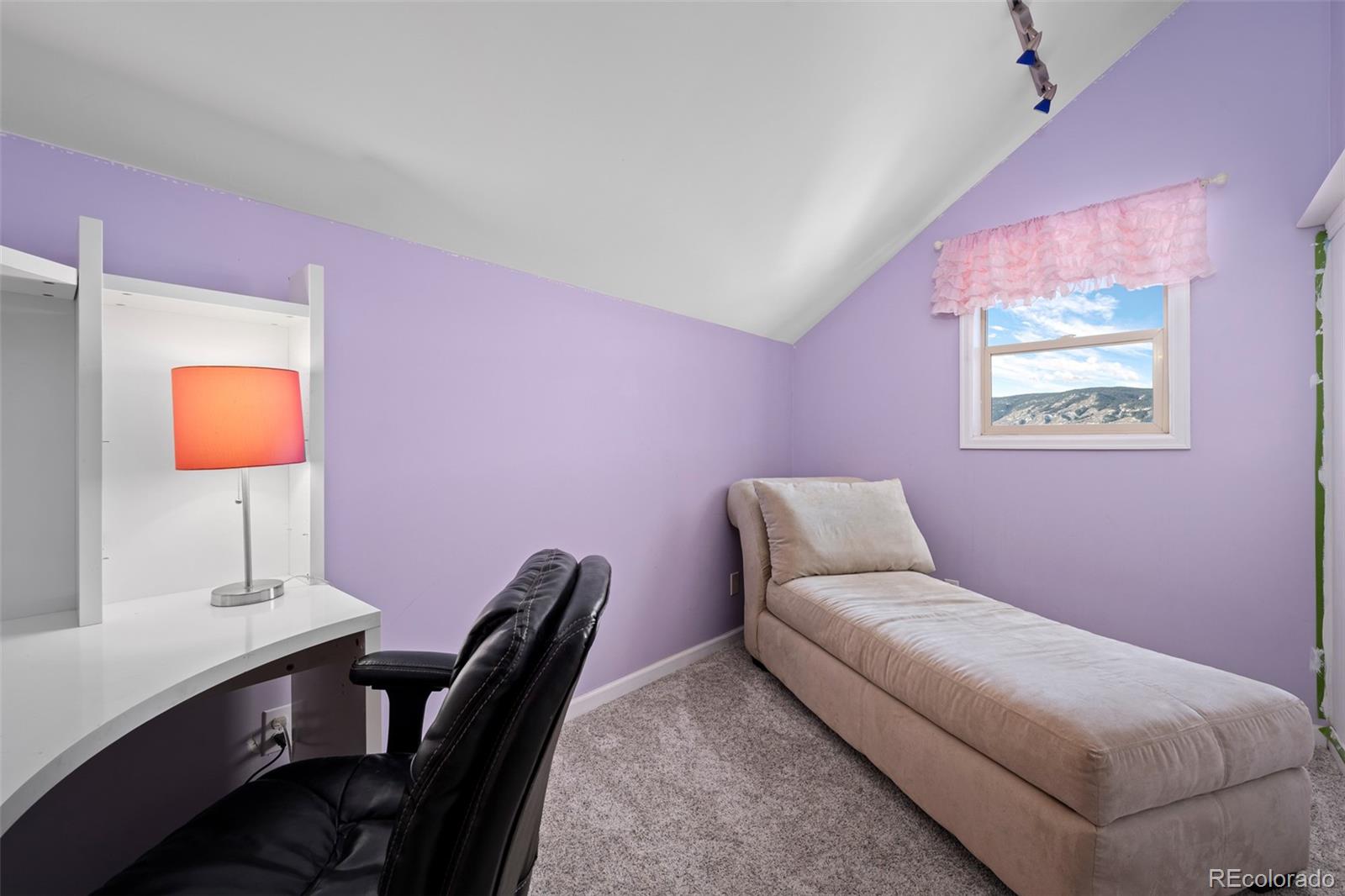 4205 West Parkridge Road Sedalia, CO 80135 - Photo 40 of 50 a bedroom with a bed and a potted plant