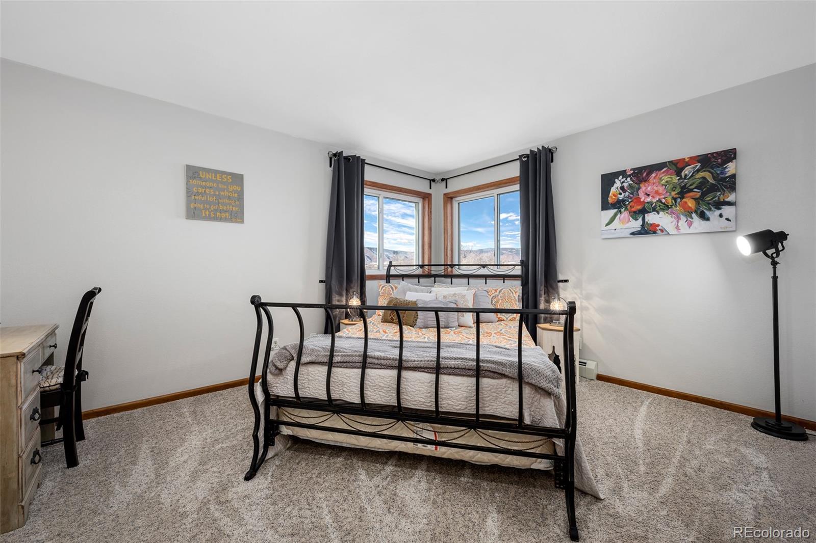 4205 West Parkridge Road Sedalia, CO 80135 - Photo 46 of 50 a bedroom with furniture and a window