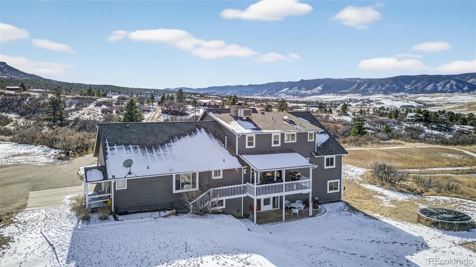 4205 West Parkridge Road Sedalia, CO 80135 - Photo 7 of 50 a aerial view of a house with a yard