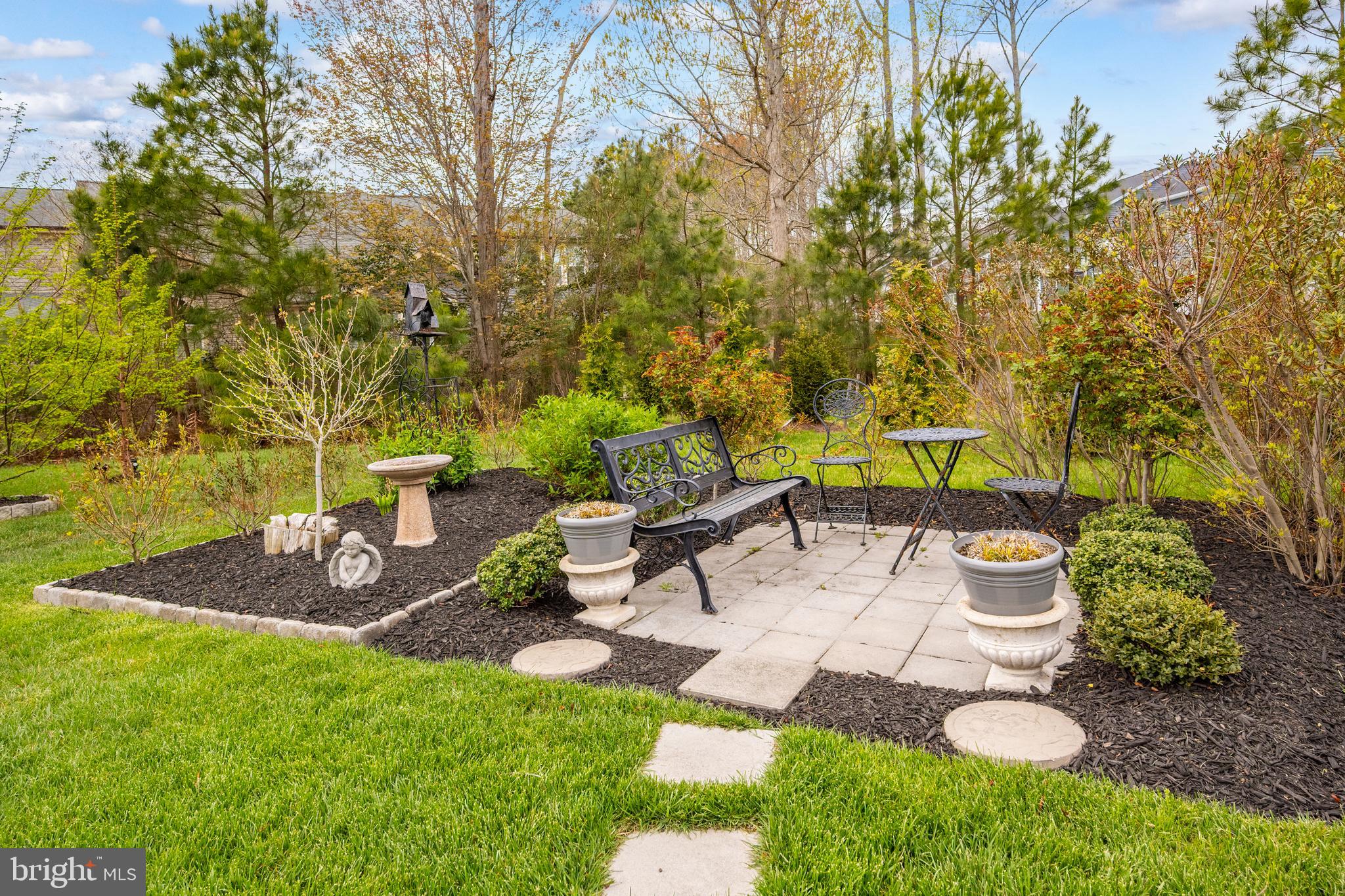 8 Old Forge Drive Ocean View, DE 19970 - Photo 72 of 103 a view of a backyard with table and chairs potted plants and tree