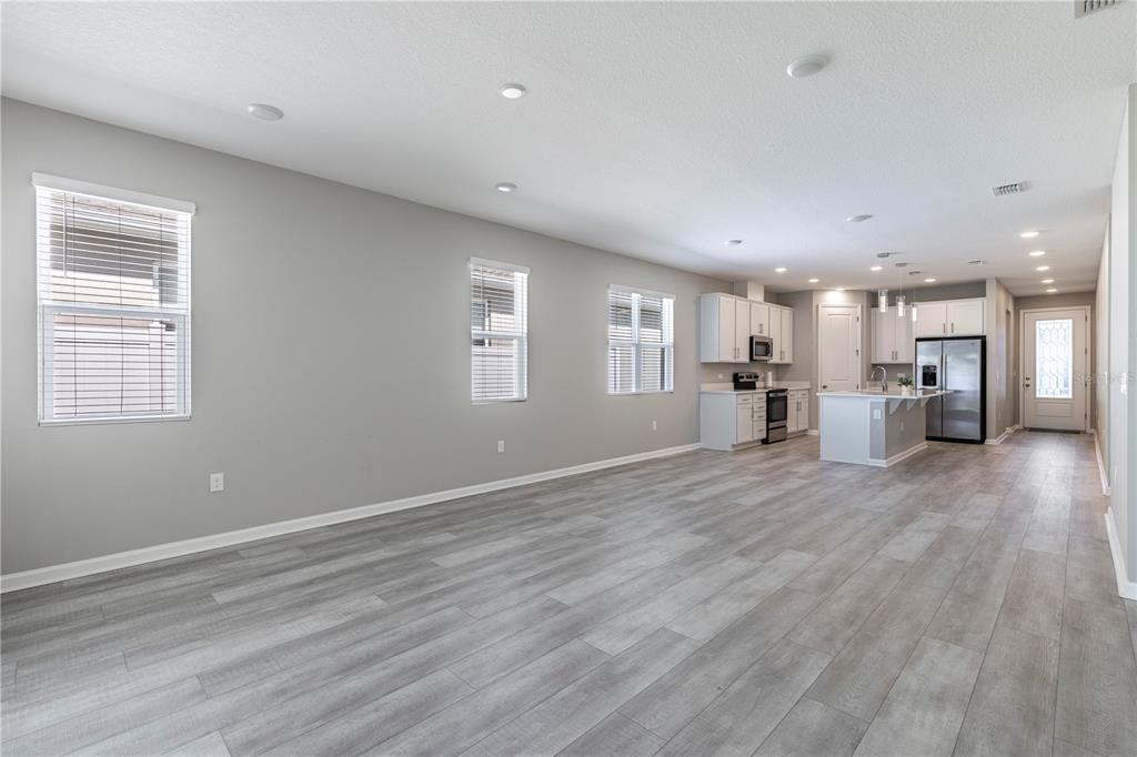10361 Church Hammock Road Leesburg, FL 34788 - Photo 16 of 46 a view of empty room with wooden floor