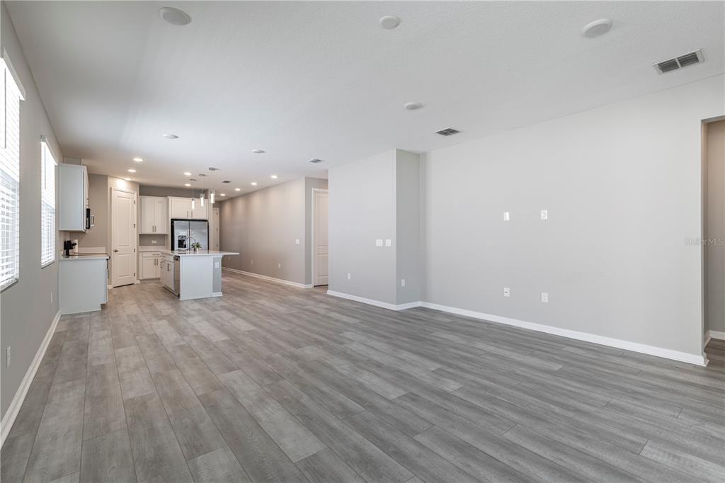 10361 Church Hammock Road Leesburg, FL 34788 - Photo 18 of 46 a view of a kitchen with a sink and a refrigerator