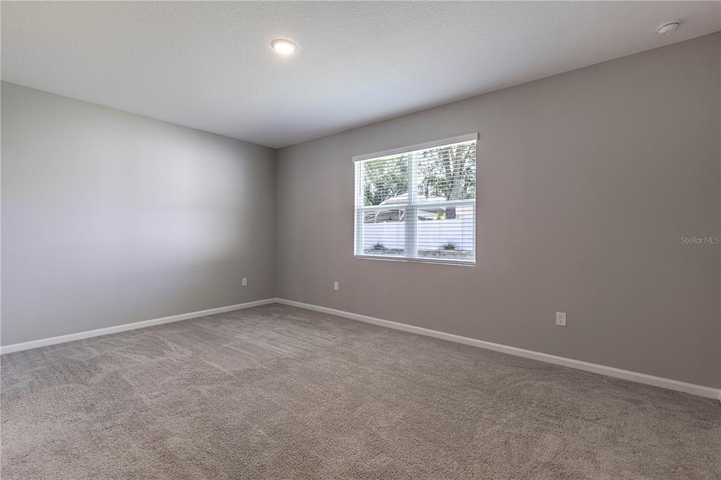 10361 Church Hammock Road Leesburg, FL 34788 - Photo 24 of 46 an empty room with windows