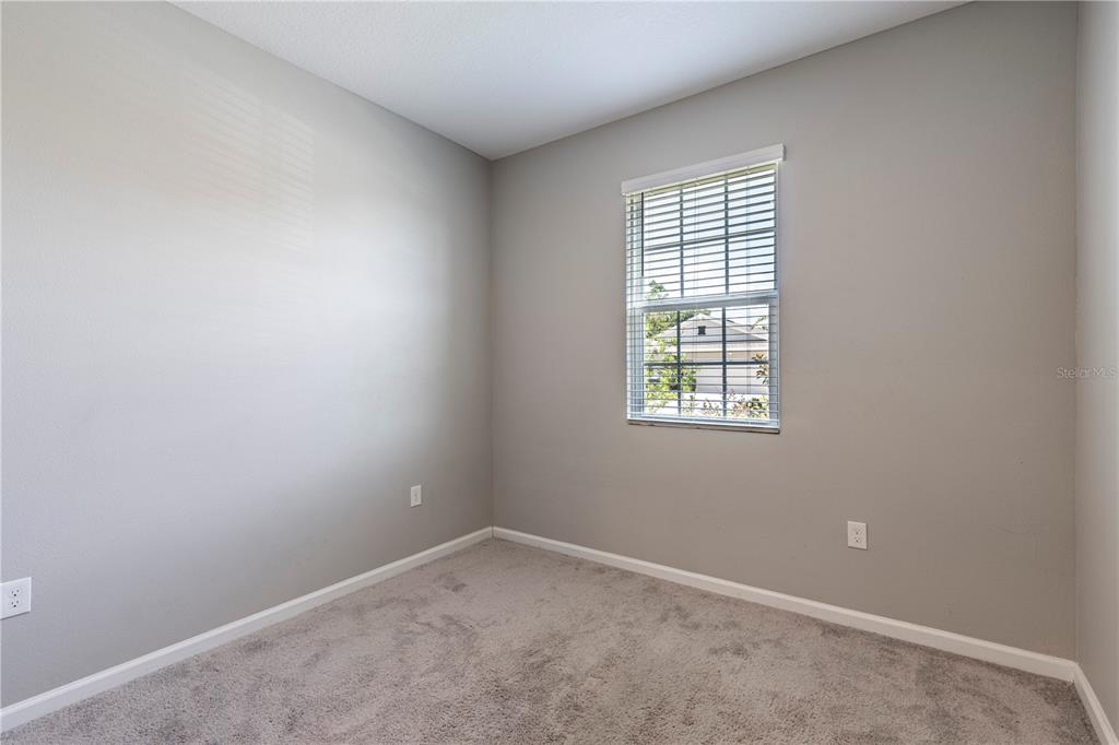 10361 Church Hammock Road Leesburg, FL 34788 - Photo 28 of 46 an empty room with a window