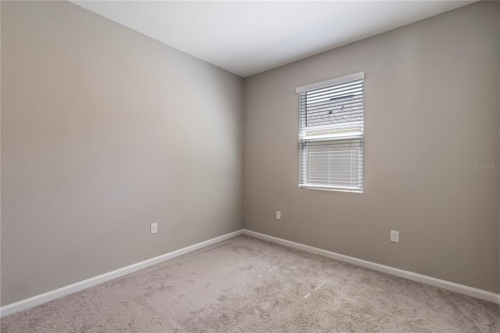 10361 Church Hammock Road Leesburg, FL 34788 - Photo 30 of 46 an empty room with a window