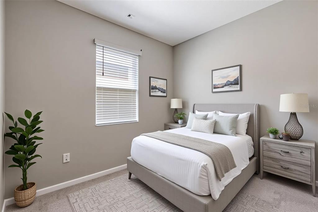 10361 Church Hammock Road Leesburg, FL 34788 - Photo 32 of 46 a bedroom with a bed and a potted plant