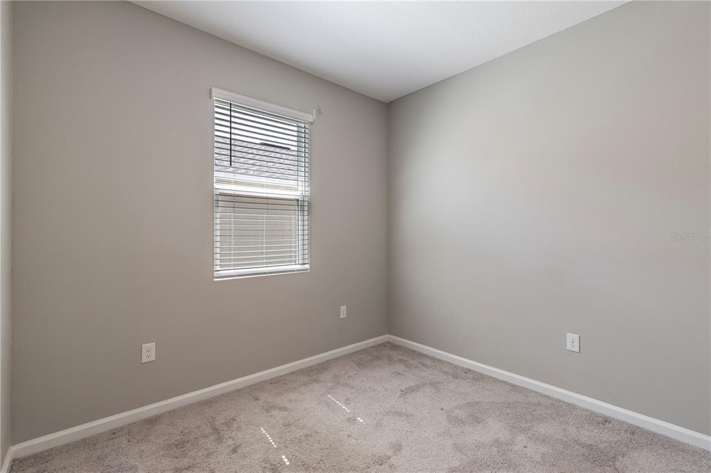 10361 Church Hammock Road Leesburg, FL 34788 - Photo 33 of 46 an empty room with a window