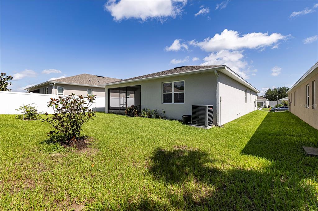 10361 Church Hammock Road Leesburg, FL 34788 - Photo 38 of 46 a yellow house with trees in front of it