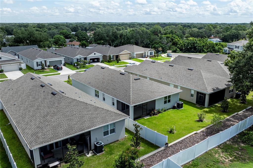 10361 Church Hammock Road Leesburg, FL 34788 - Photo 42 of 46 an aerial view of residential houses with yard and swimming pool