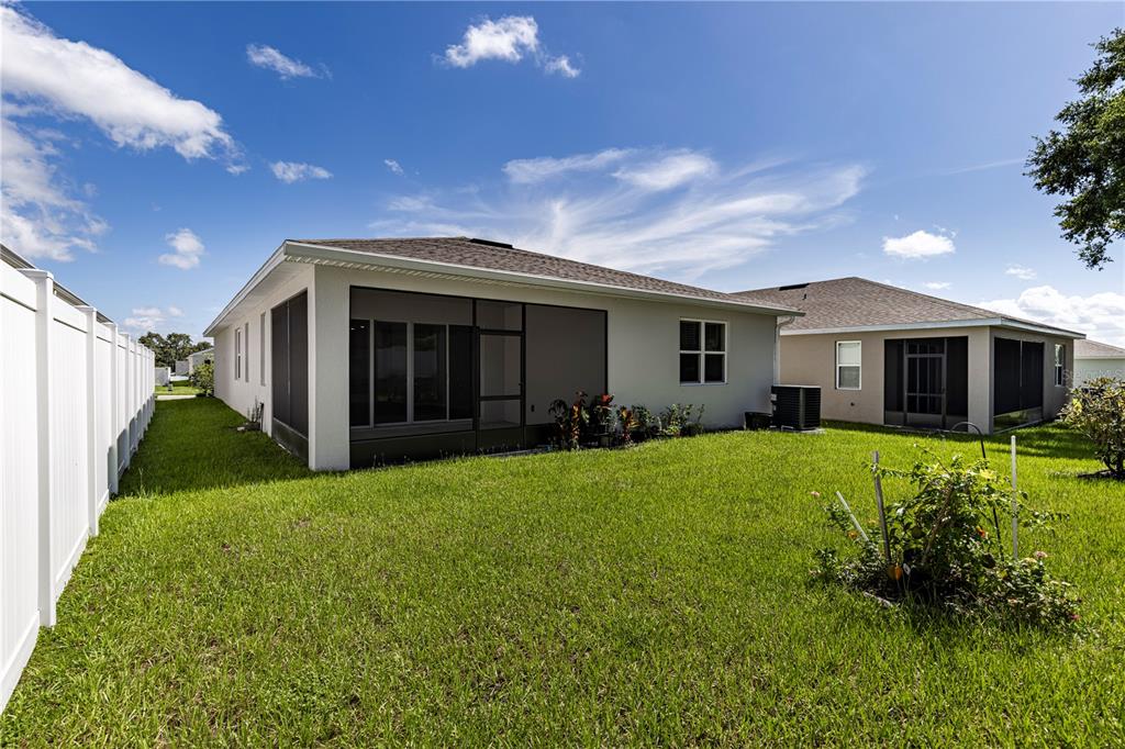 10361 Church Hammock Road Leesburg, FL 34788 - Photo 5 of 46 a view of a house with back yard