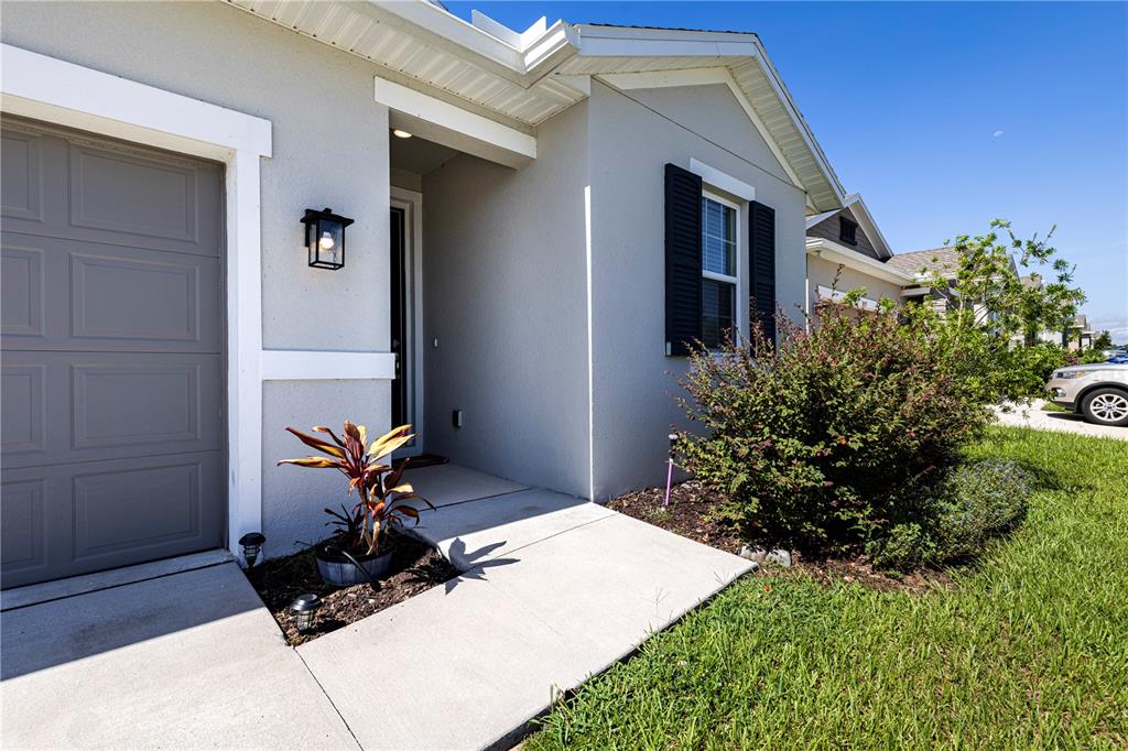10361 Church Hammock Road Leesburg, FL 34788 - Photo 7 of 46 a front view of a house with a yard