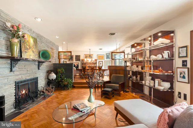 a living room with furniture and a fireplace
