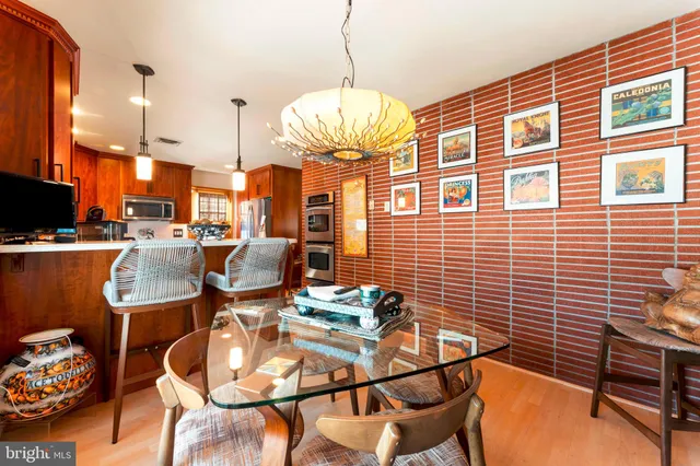 a kitchen that has a sink a stove and a refrigerator
