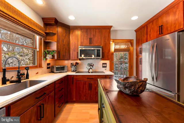 a living room with furniture a rug and a large window