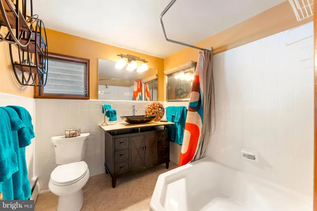 a very nice looking room with many windows and furniture